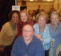 “Voice cast of Josie and the Pussycats in a recording studio”