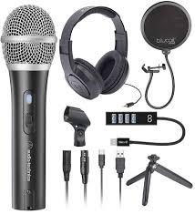 Voiceover gear setup with microphone, pop filter, headphones, and acoustic treatment.