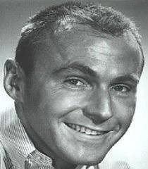 Jerry Dexter smiling in a vintage studio portrait, 1970s”